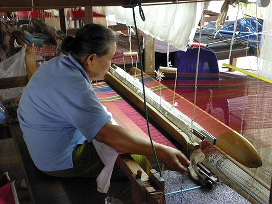 We did see this women take this wooden stick and throw it back and forth. The stick had gold silk attached to the end of it.
