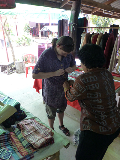 Trying on a one-size fits all dress. Not flattering on me at all.