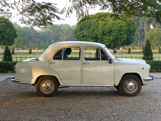 Police car parked outside of the monument. Kolkata was full of this exact car, used as taxis, private cars and police cars. 