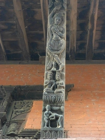 Wood carving with some naughty Kama Sutra action at the bottom. 