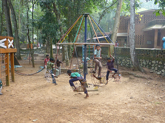 Some boys playing in the park area.