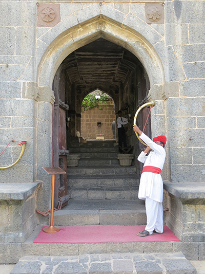 They blow this horn and play a drum for every arriving guest.