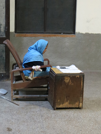 Sleeping attendant at the train station waiting room.