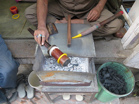 This guy was making bangles by hand to sell in his store. So much is still made by hand in India. 
