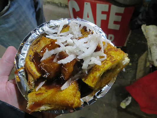 Yummy street food. Potato sandwich with a side of potatoes. 