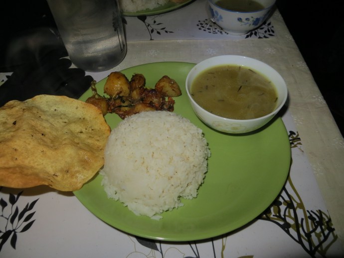 This is a picture of the typical nepali food, daal bhat. Which consists of a lentil curry, rice, and some sort of vegetable. You usually get two servings of everything as well, which is good for hungry trekkers.