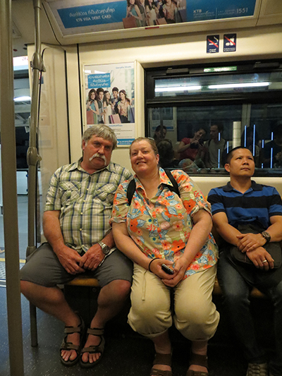 Phil and Karen riding the BTS train system in Bangkok.