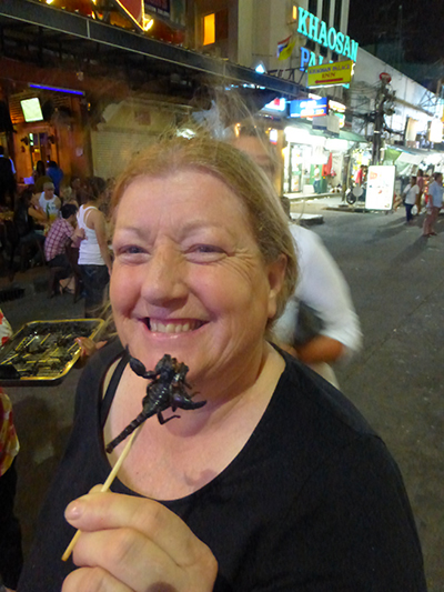 Karen accepting the challenge to eat a scorpion. Well done.