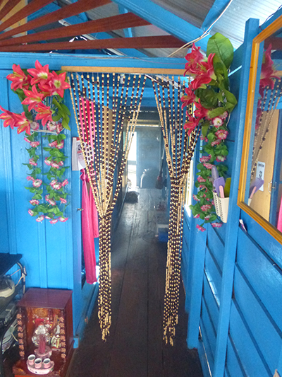 The hall that leads to the bedrooms, kitchen, and bathroom.